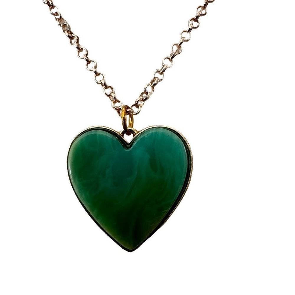 Green heart pendant on gold tone chain necklace
